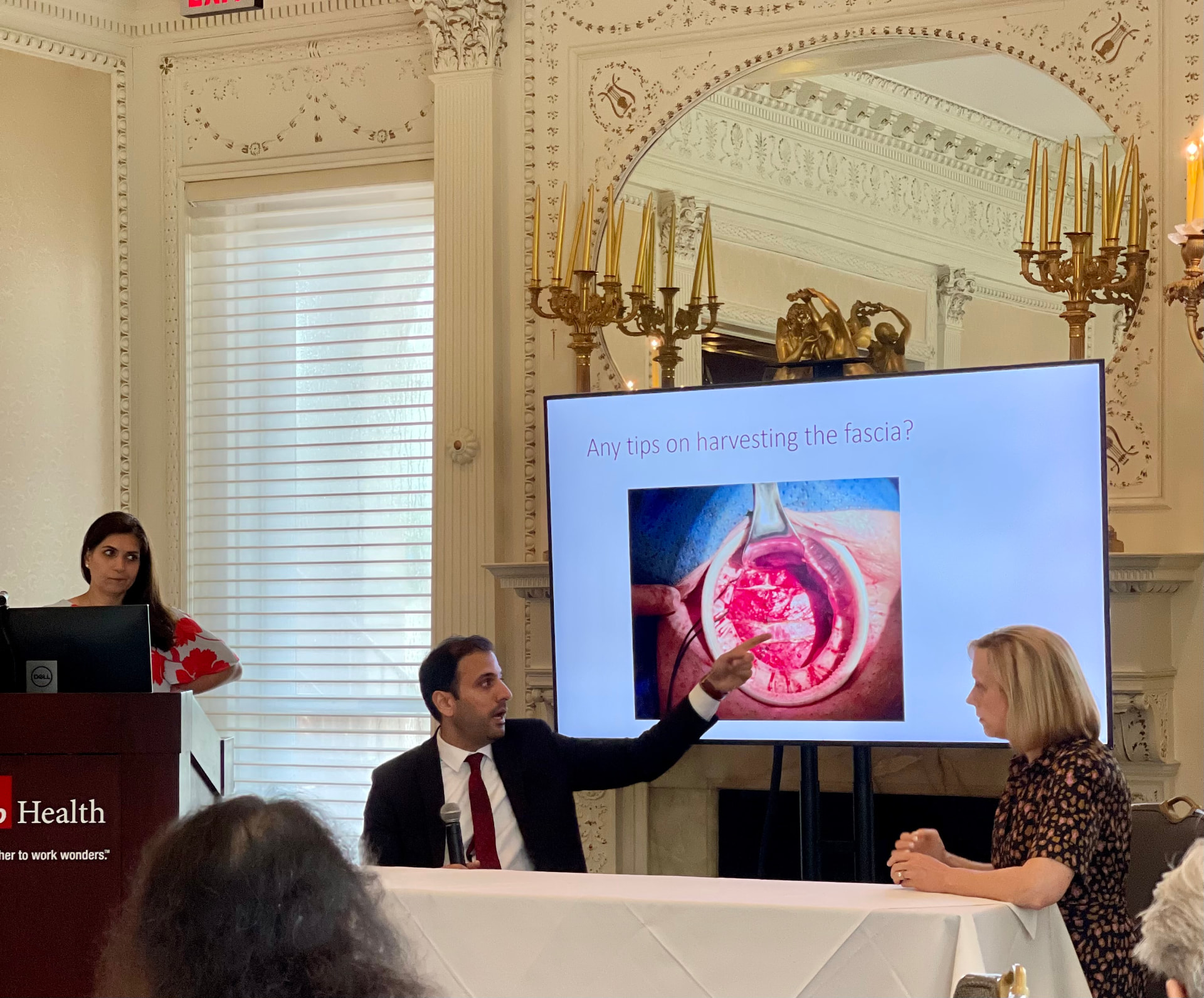 Dr. Farhan teaching surgical technique during a panel discussion