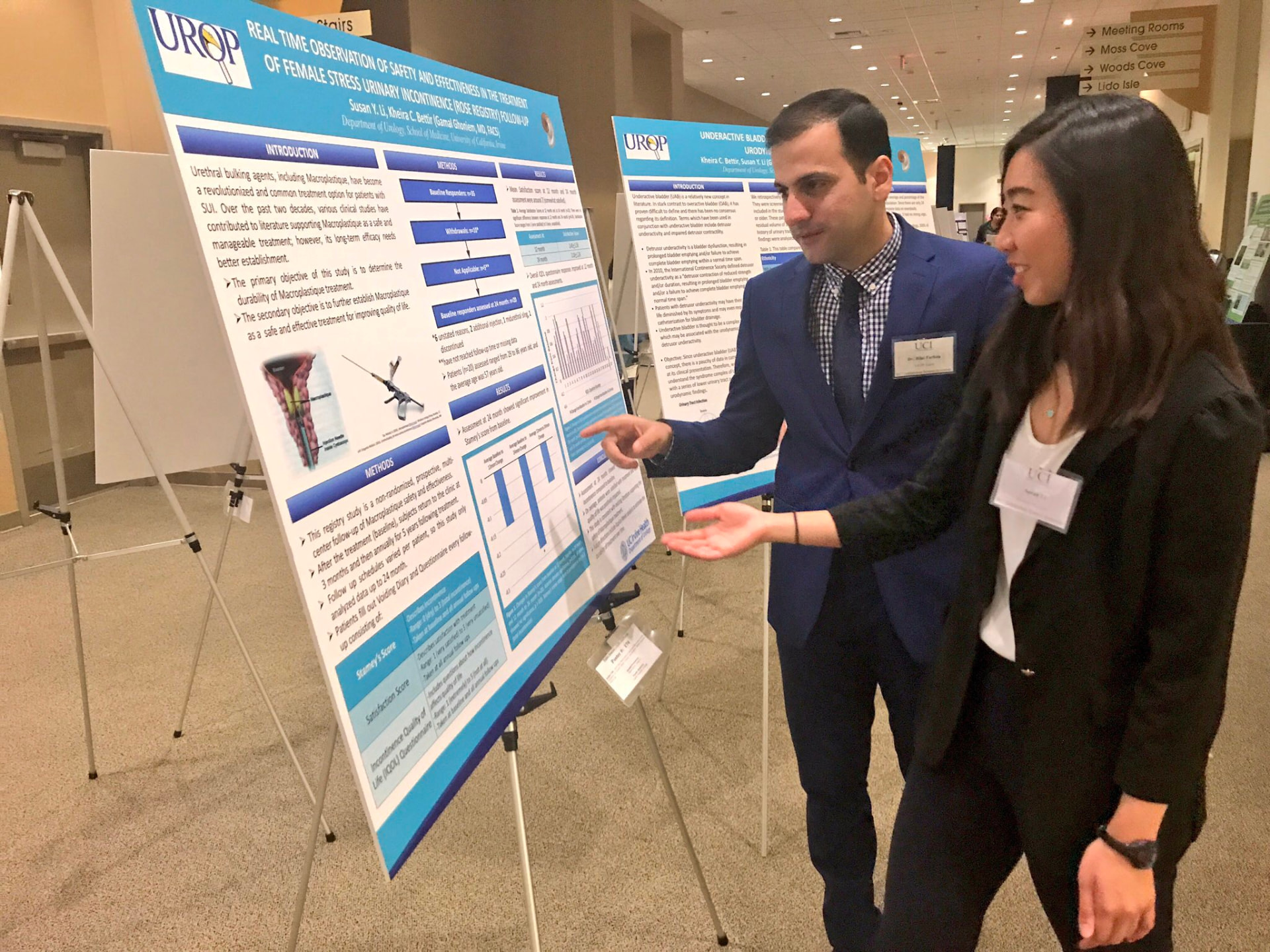 Dr. Farhan mentoring a student presenting urology research at UC Irvine