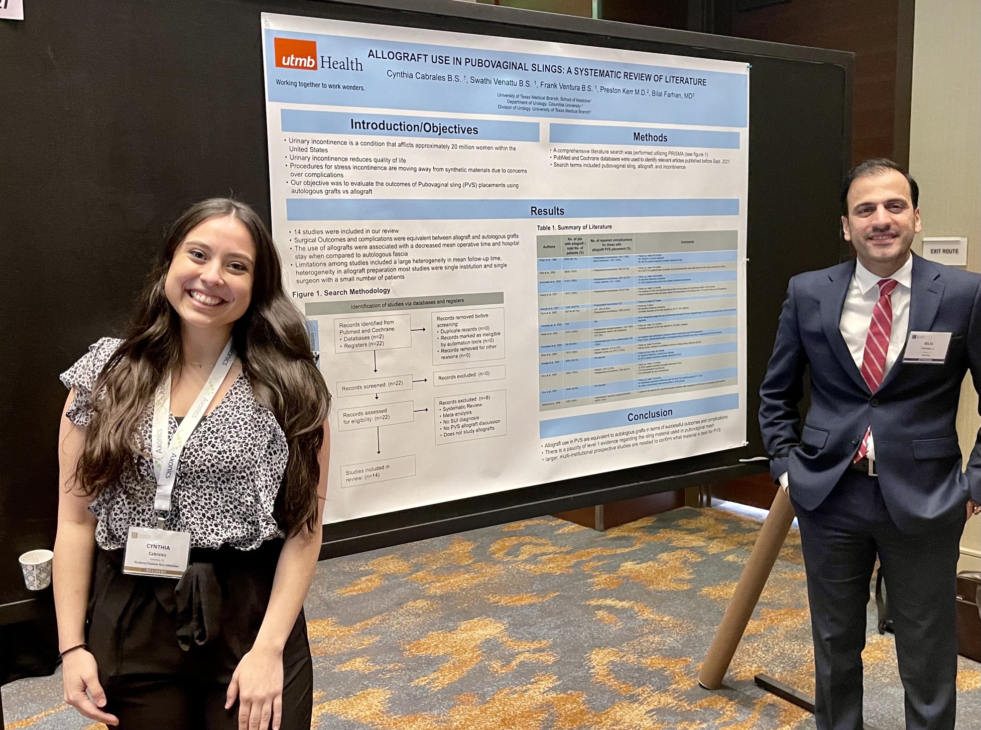 Dr. Farhan mentoring a medical student presenting a UTMB urology research poster
